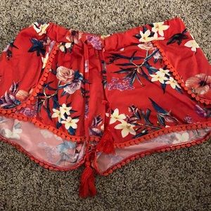 red floral shorts